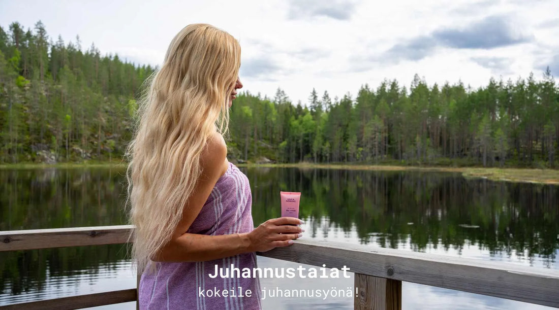 Nainen day cream voidepurkki kädessään vilvoittelemassa laiturilla ja taustalla upea kesäinen, suomalainen järvi ja luonto.